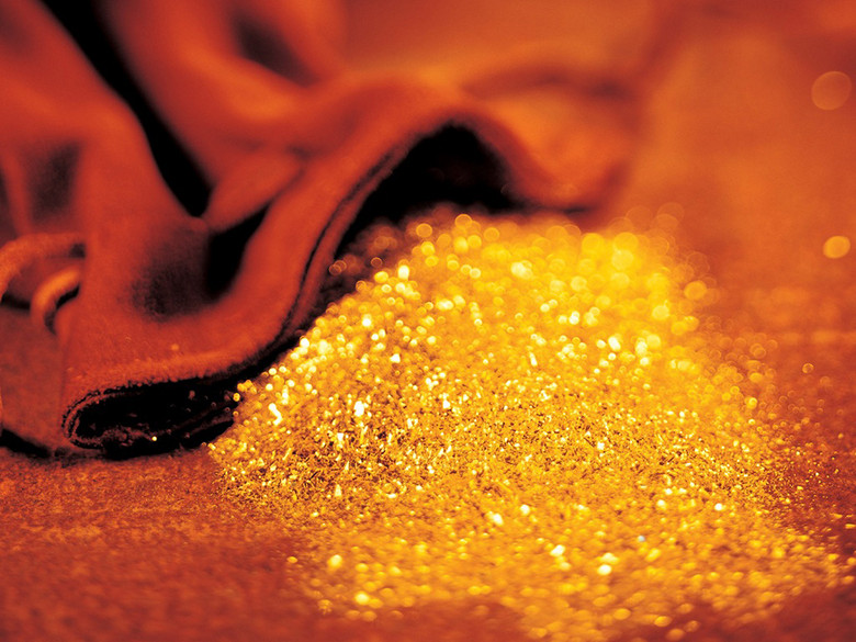 一袋子黄金粉末沙子背景素材图片模板
